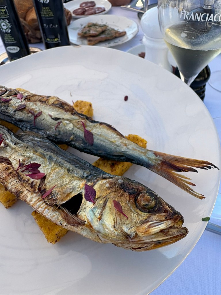 Salted and dried sardines are served over fried polenta bars