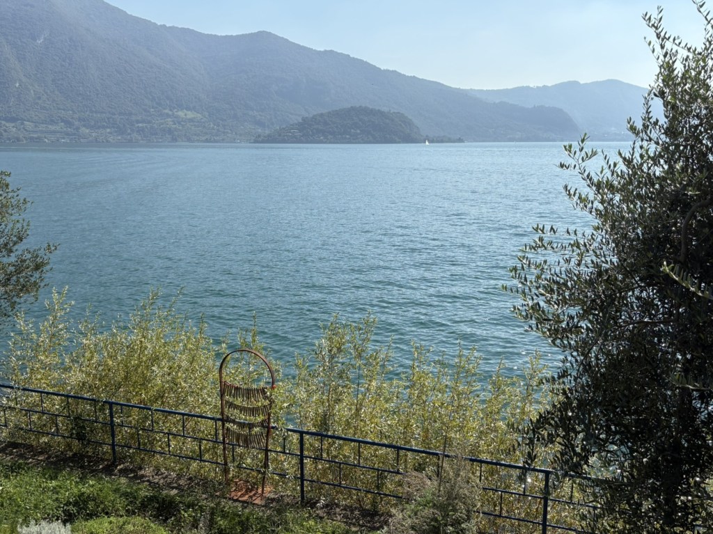 Garden art pieces imitating fish-drying frames decorate the lakeside