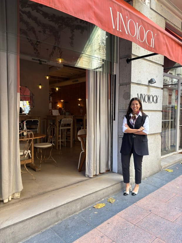 Woman standing outside of wine bar