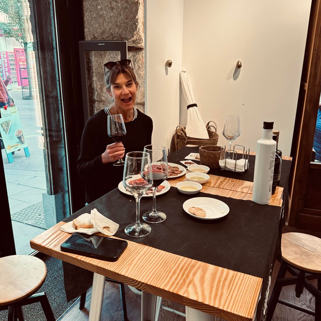woman with wine glass at dinner table