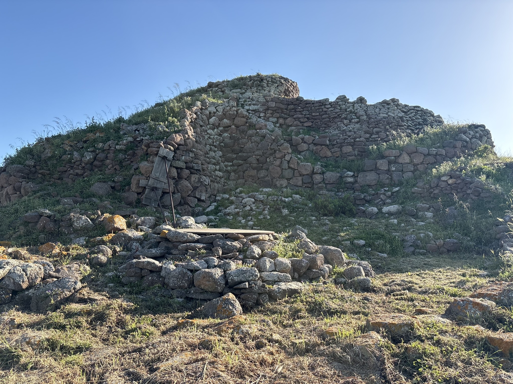 Stone archaeological structures on top of a hill