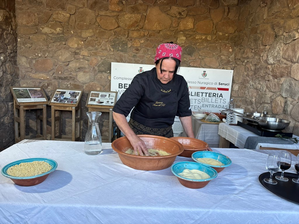 Woman makes couscous in a bowl